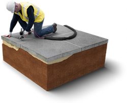Professional technician injecting high-density polyurethane foam to lift and level sunken concrete slab