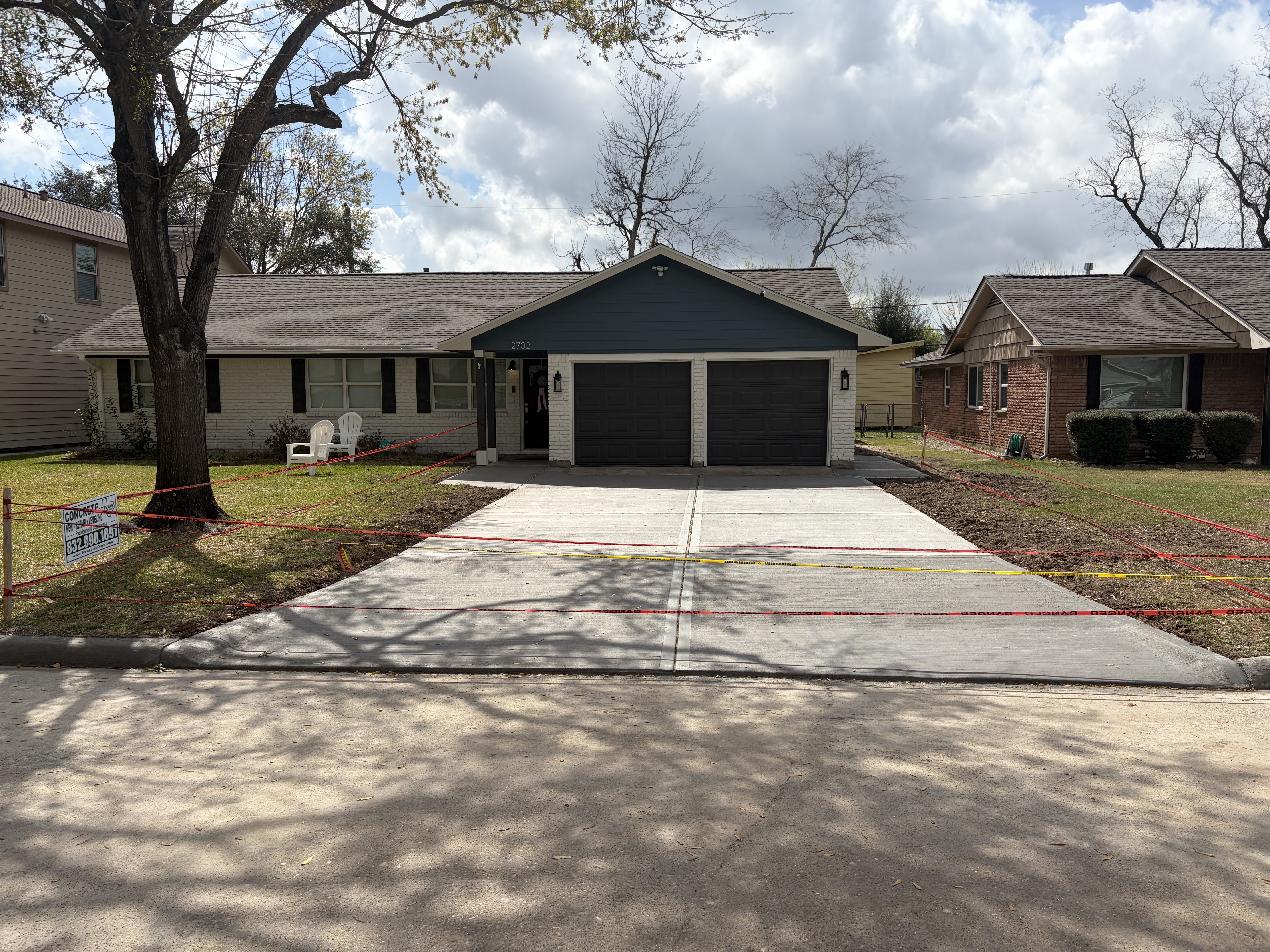 Completed new concrete driveway installation in Houston Texas by Texas Slab Guys